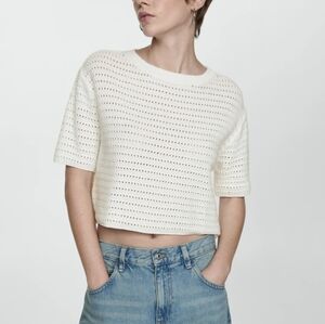 Knitted sweater with openwork details